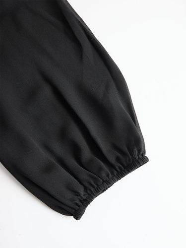 Completo da donna con top a collo alto trasparente e pantaloni a gamba larga 4