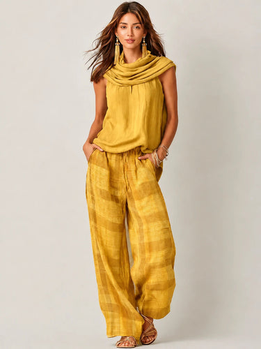 Completo da donna con top smanicato a collo alto e pantaloni a gamba larga a quadri 5