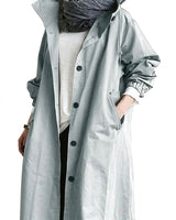 Trench coat da donna con cappuccio e chiusura a bottoni 1