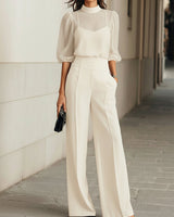 Completo da donna con top a collo alto trasparente e pantaloni a gamba larga 2