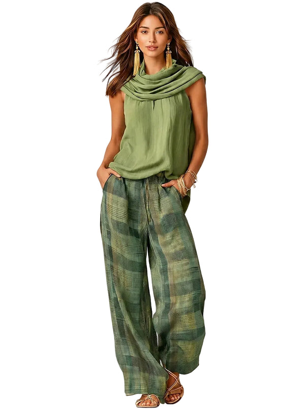 Completo da donna con top smanicato a collo alto e pantaloni a gamba larga a quadri 1