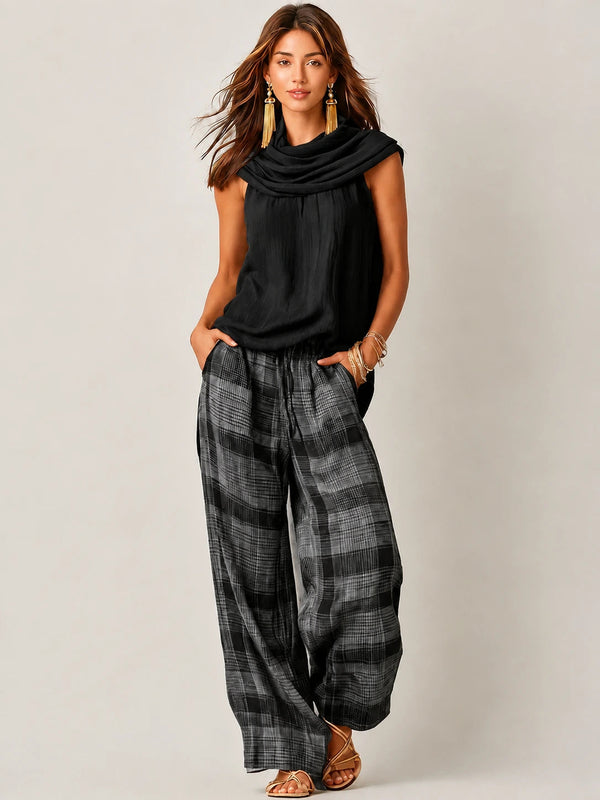 Completo da donna con top smanicato a collo alto e pantaloni a gamba larga a quadri 2