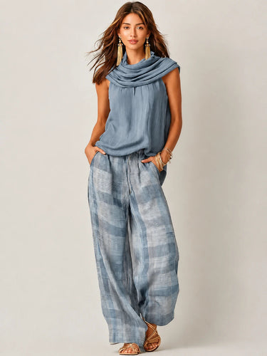 Completo da donna con top smanicato a collo alto e pantaloni a gamba larga a quadri 4